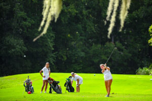 Teenage girls golfing
