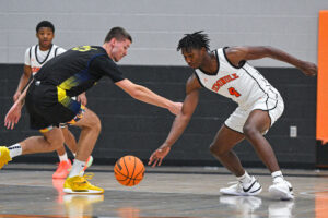 Teenage boys playing basketball
