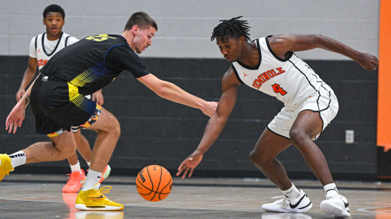Teenage boys playing basketball