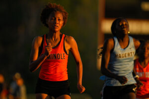 High School girl running in race.