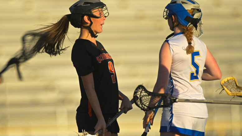 High School Girls playing Lacrosse
